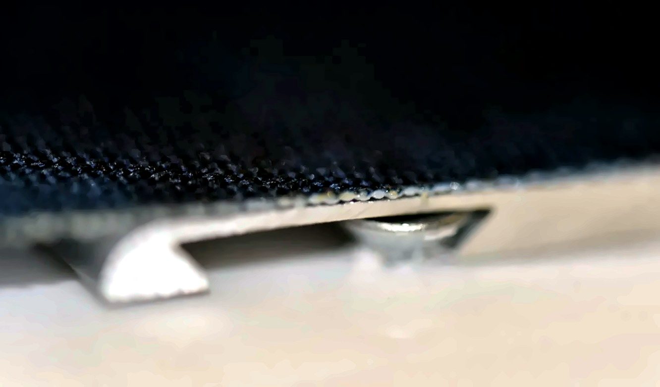 Screw head captured inside the hidden batten channel
